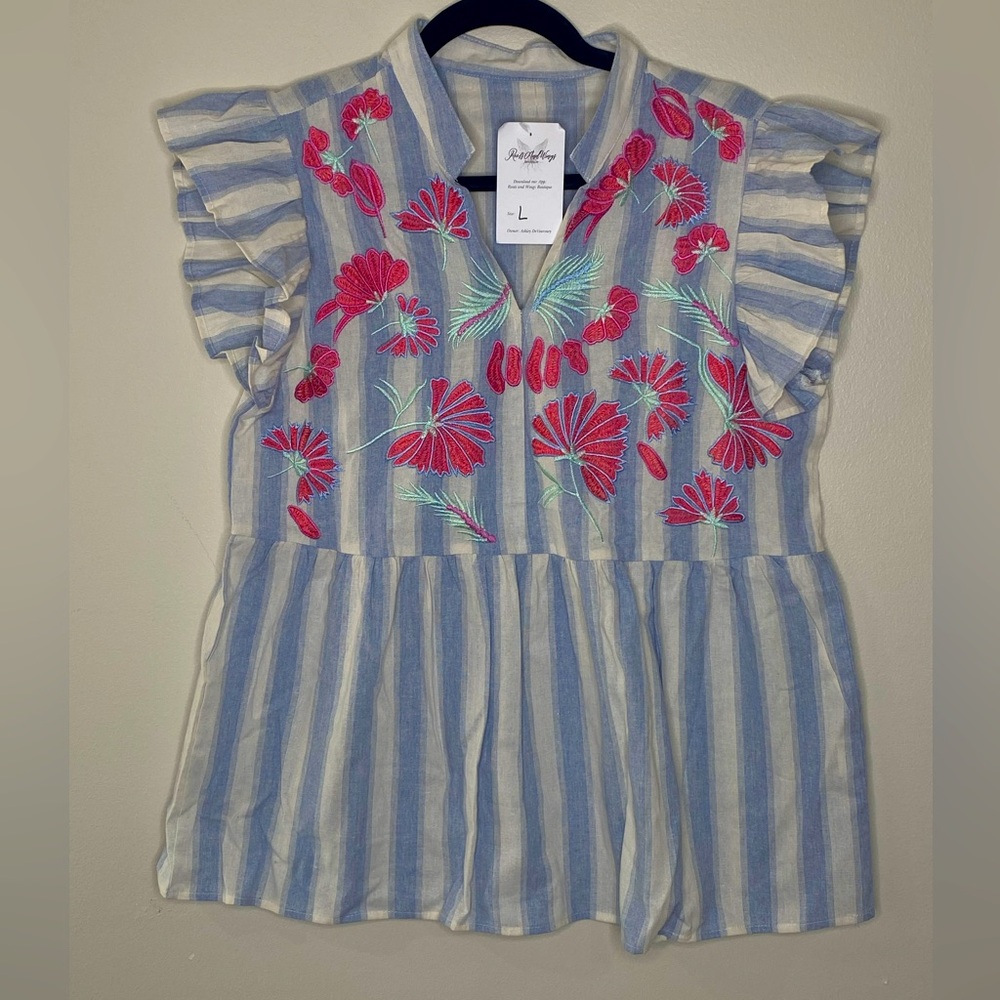 Blue & White Striped Embroidered Boutique Top
Size Large
NWT
